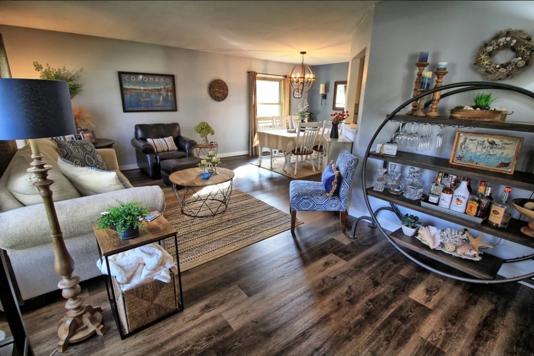Living room after — coastal styling with layered textures and curated décor